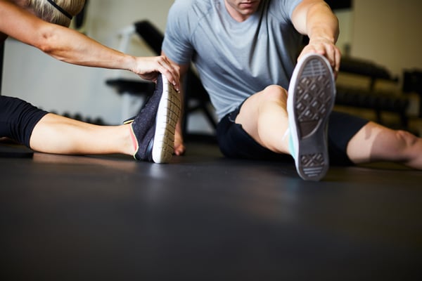 Man and woman stretching