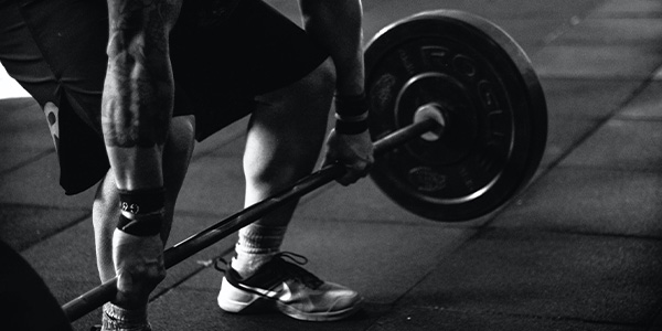 man lifting weights