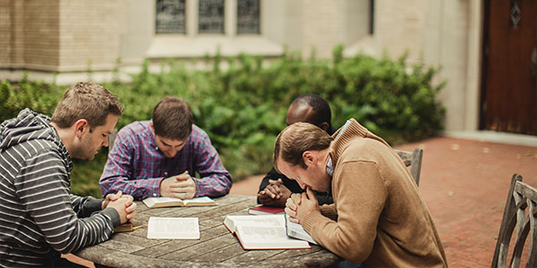 mens group praying