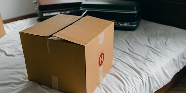 moving box sitting on a bed