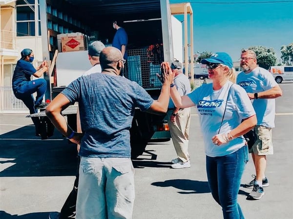 Christian Care Ministry team members high fiving