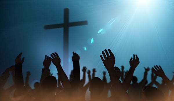 people worshipping in church