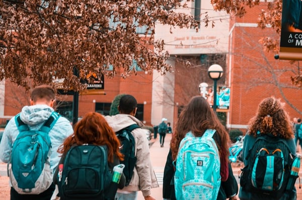 Students standing outside of their university.