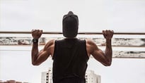 Fit man doing pull-ups