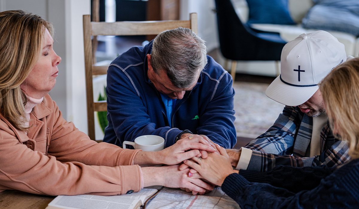 Two Medi-Share members praying together.