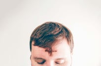 Man with ash-drawn cross on his forehead