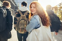 Female student with high school classmates