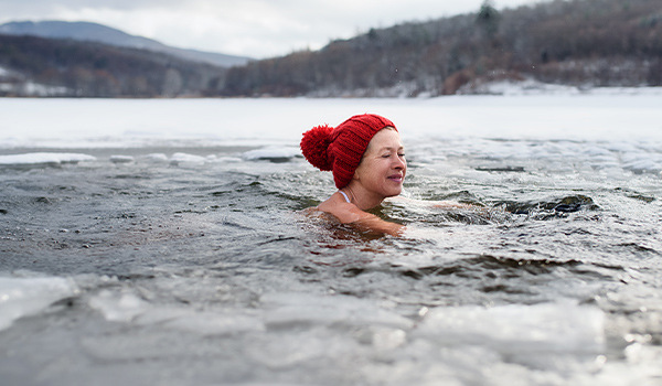 senior woman doing cold plunge