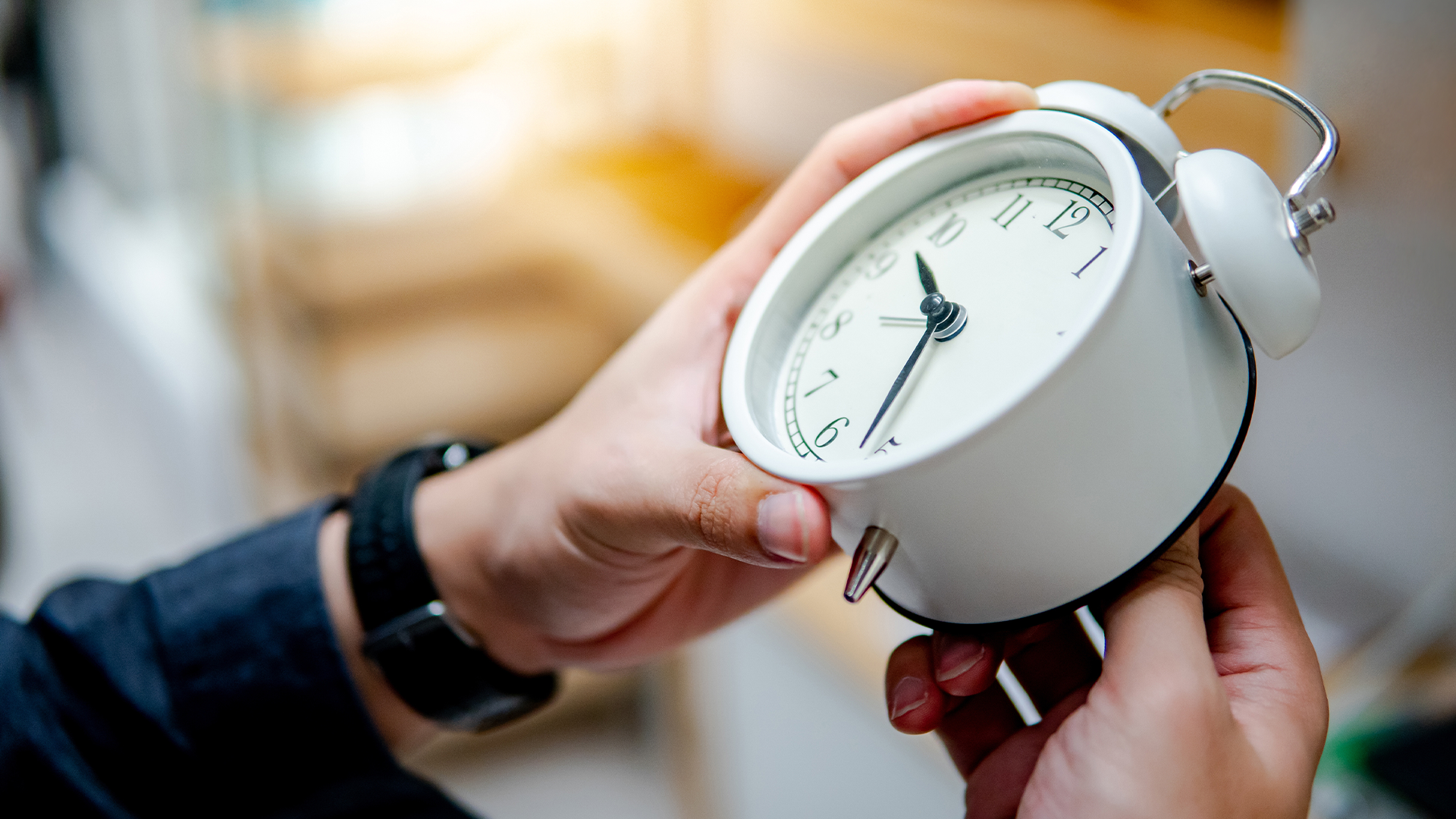 A clock being adjusted for Daylight Savings
