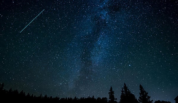 starry night sky with shooting star