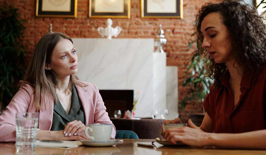 two women talking seriously