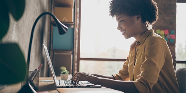 women working on computer at home