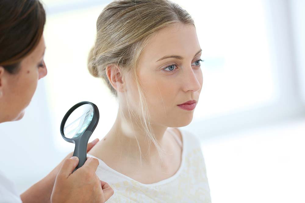 Dermatologist checking for skin cancer