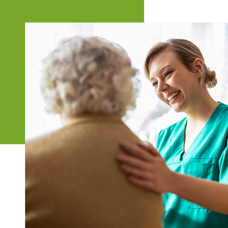 Older woman being comforted by a medical professional