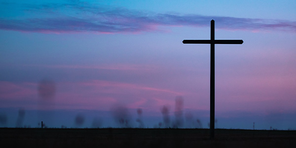cross with a sunset background 